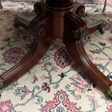 Victorian extendable dining table. Rosewood, bronze decoration. England. Early 19th century.