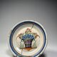 Two antique 18th-century faience plates, stapled.