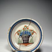 Two antique 18th-century faience plates, stapled.