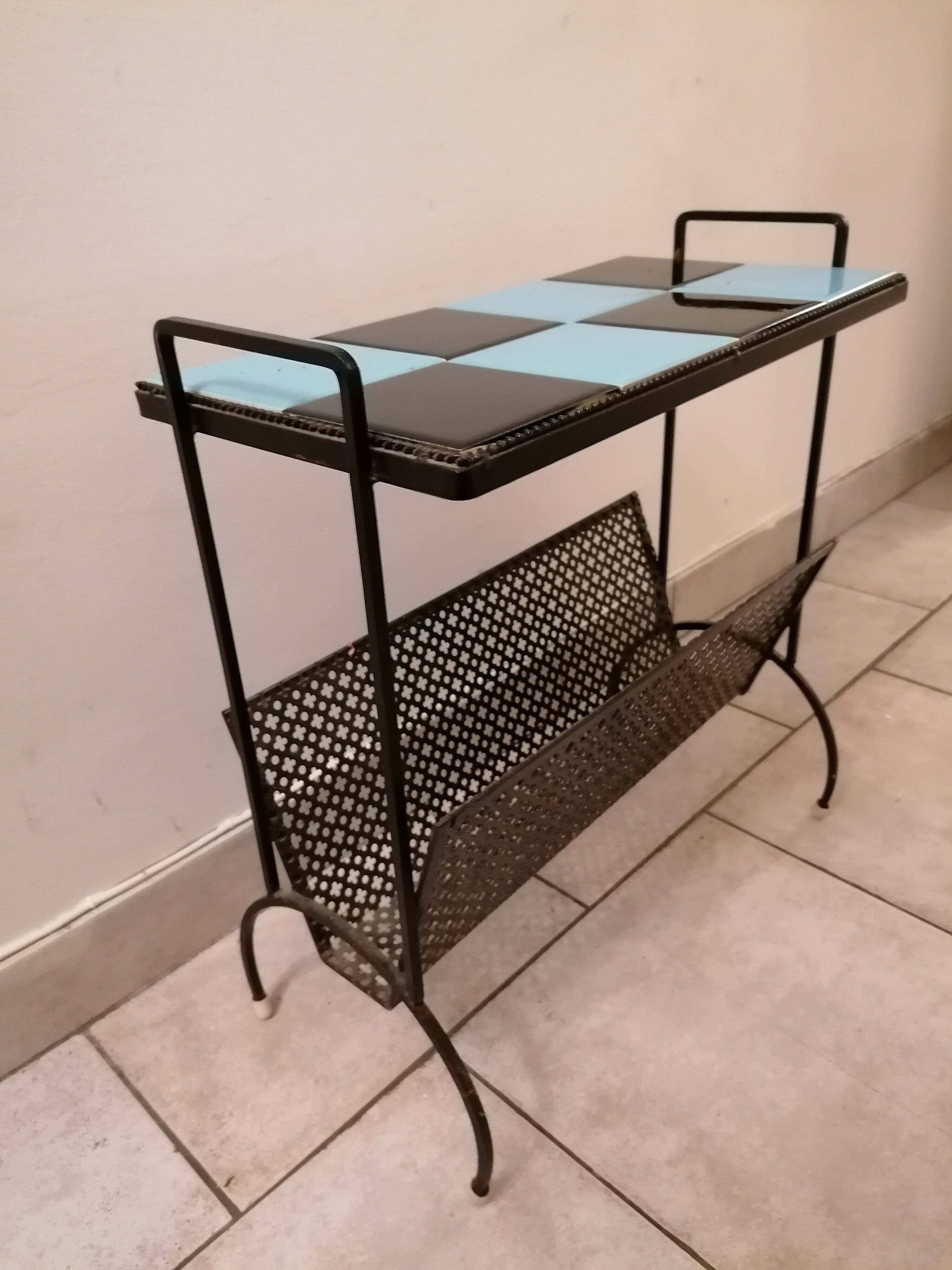 Table carries steel magazines perforated sheet metal vintage ceramic checkerboard