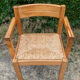 Brutalist chair in solid pine with a straw seat from the 1970s.
