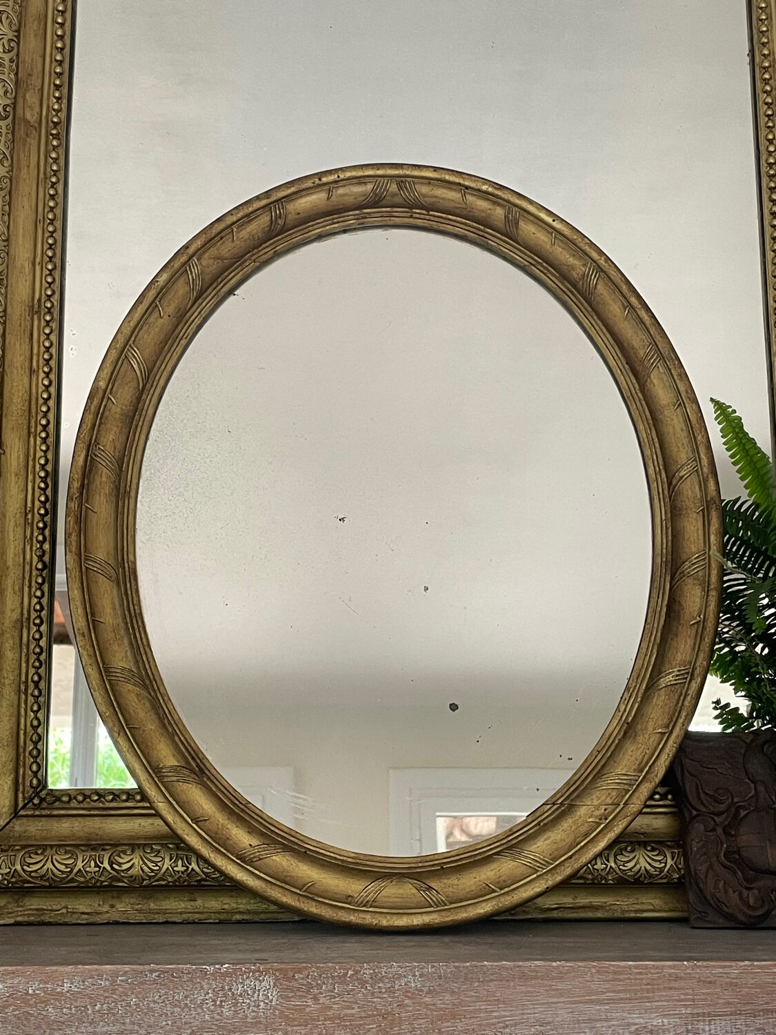 58cm patinated gilded wood mirror