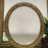 Miroir en bois doré patiné 58cm