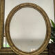 Miroir en bois doré patiné 58cm