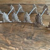 Series of 12 monogrammed silver metal knife holders