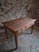 French antique dining table in cherry wood with two drawers, circa 1880–1920.
