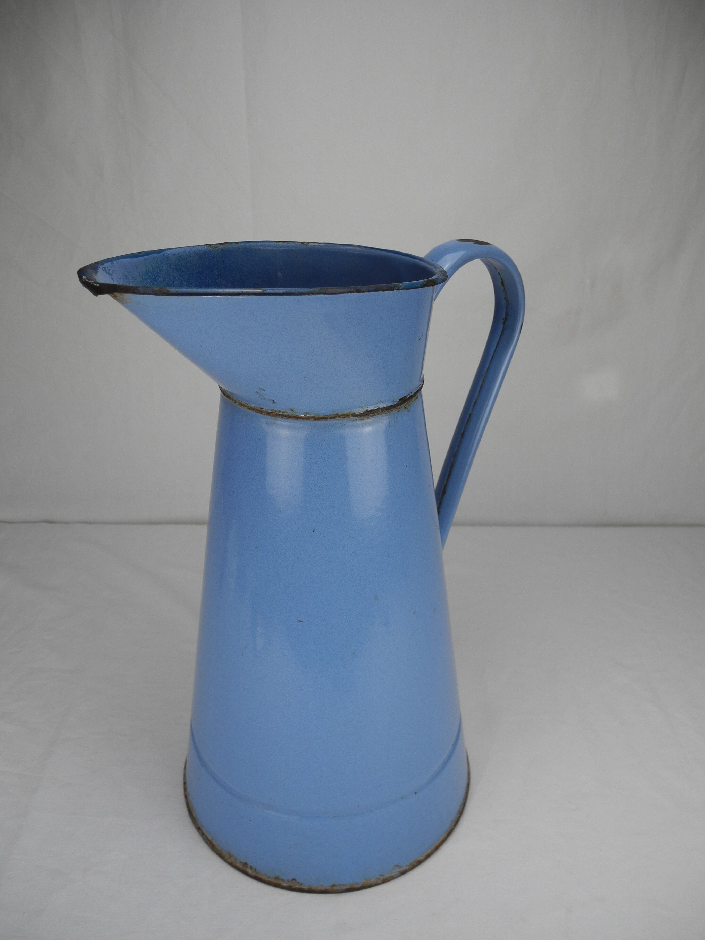 Old vintage enamelled sheet metal jug