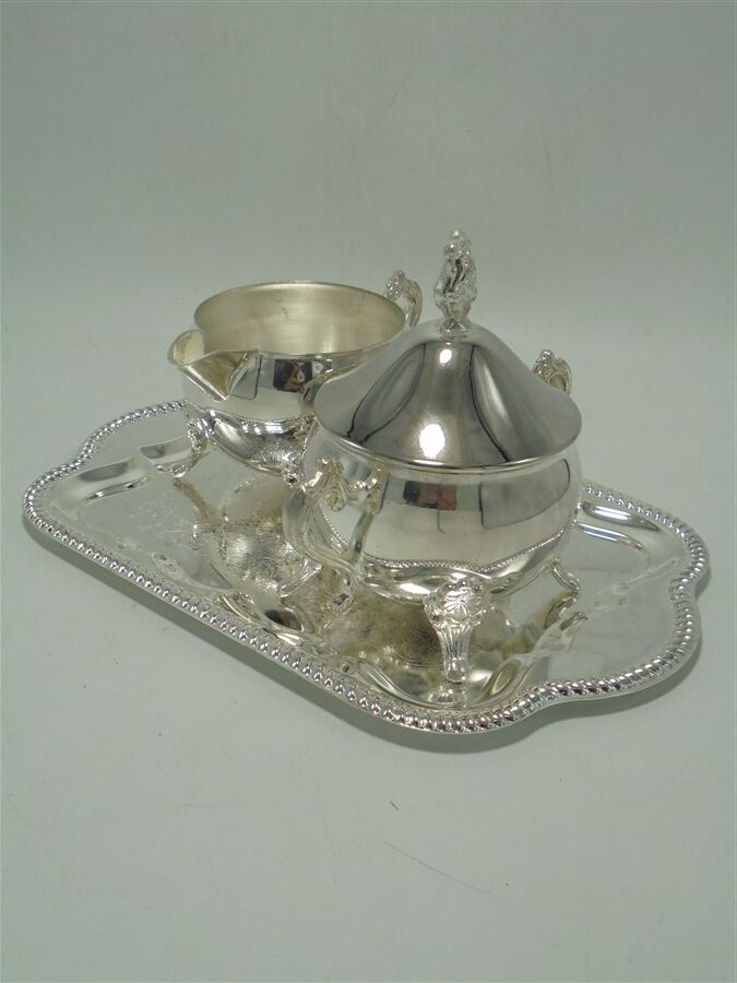 Sugar bowl and milk jar on tray