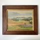 Old oil painting of a landscape on panel from 1920, haystacks.