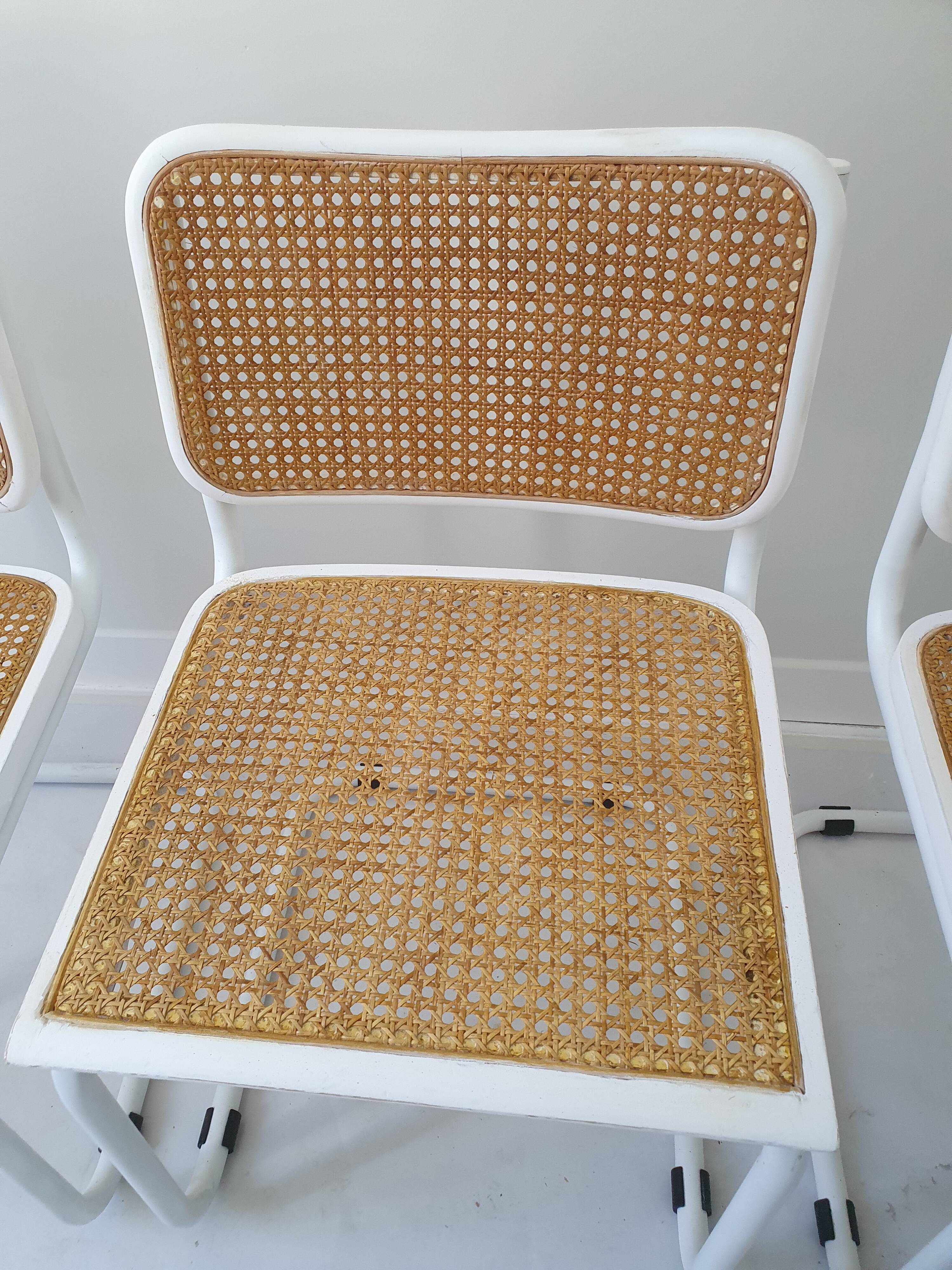 B32 chairs by Marcel Breuer in white.