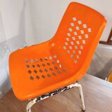 Chair with openwork plastic shell 1970