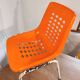 Chair with openwork plastic shell 1970