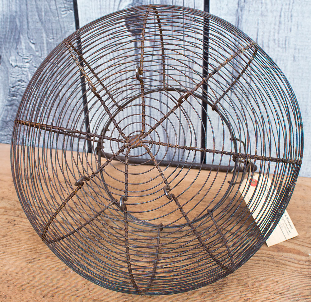 Old basket has wire eggs