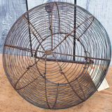 Old basket has wire eggs