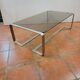 Coffee table with stainless steel base and smoked glass, from the 70s