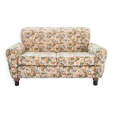 2-seater sofa, floral fabric, wooden structure, plastic and wooden legs, 1970