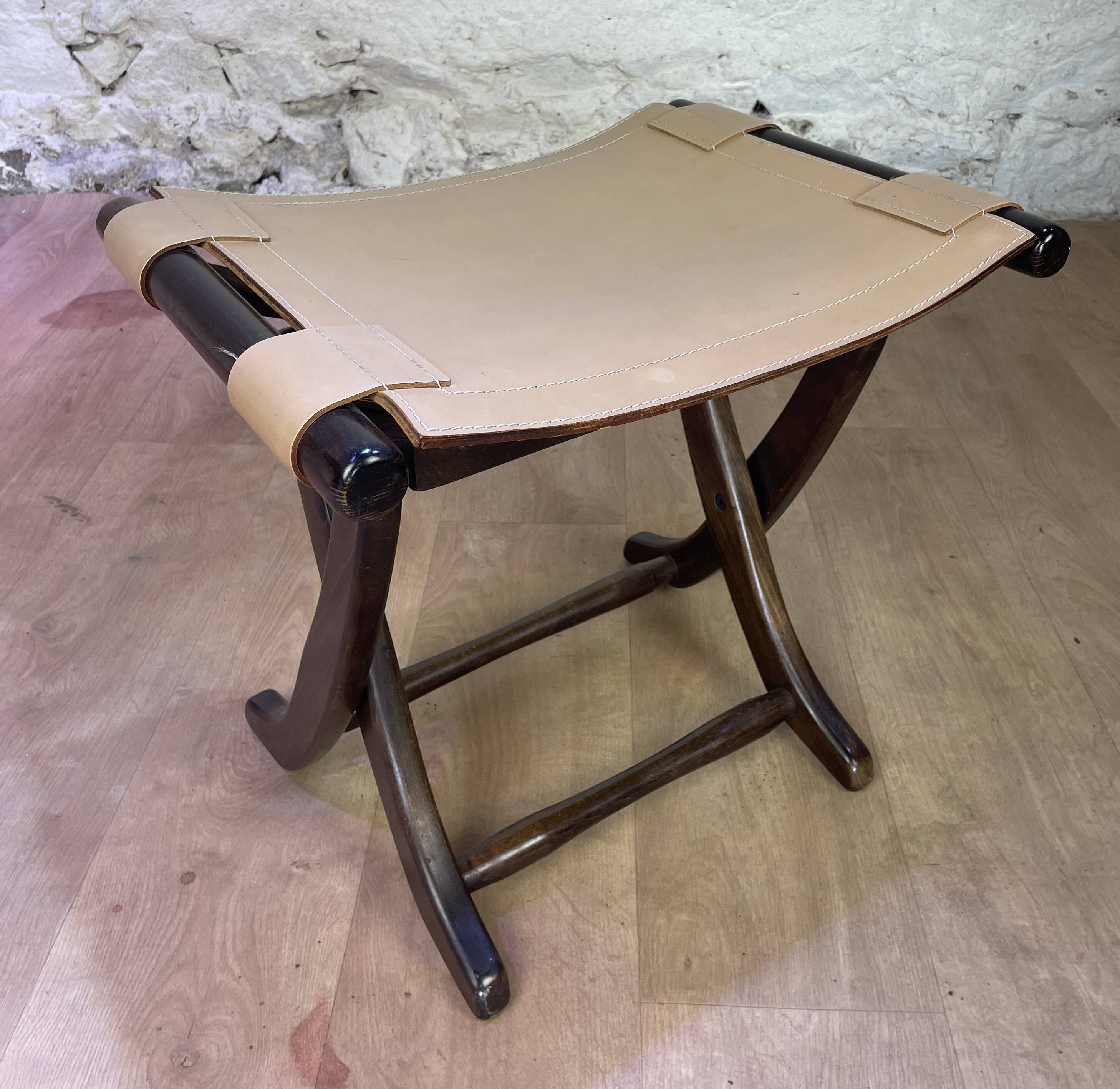 Colonial style leather armchair and ottoman