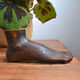 Carved wooden Buddha's foot