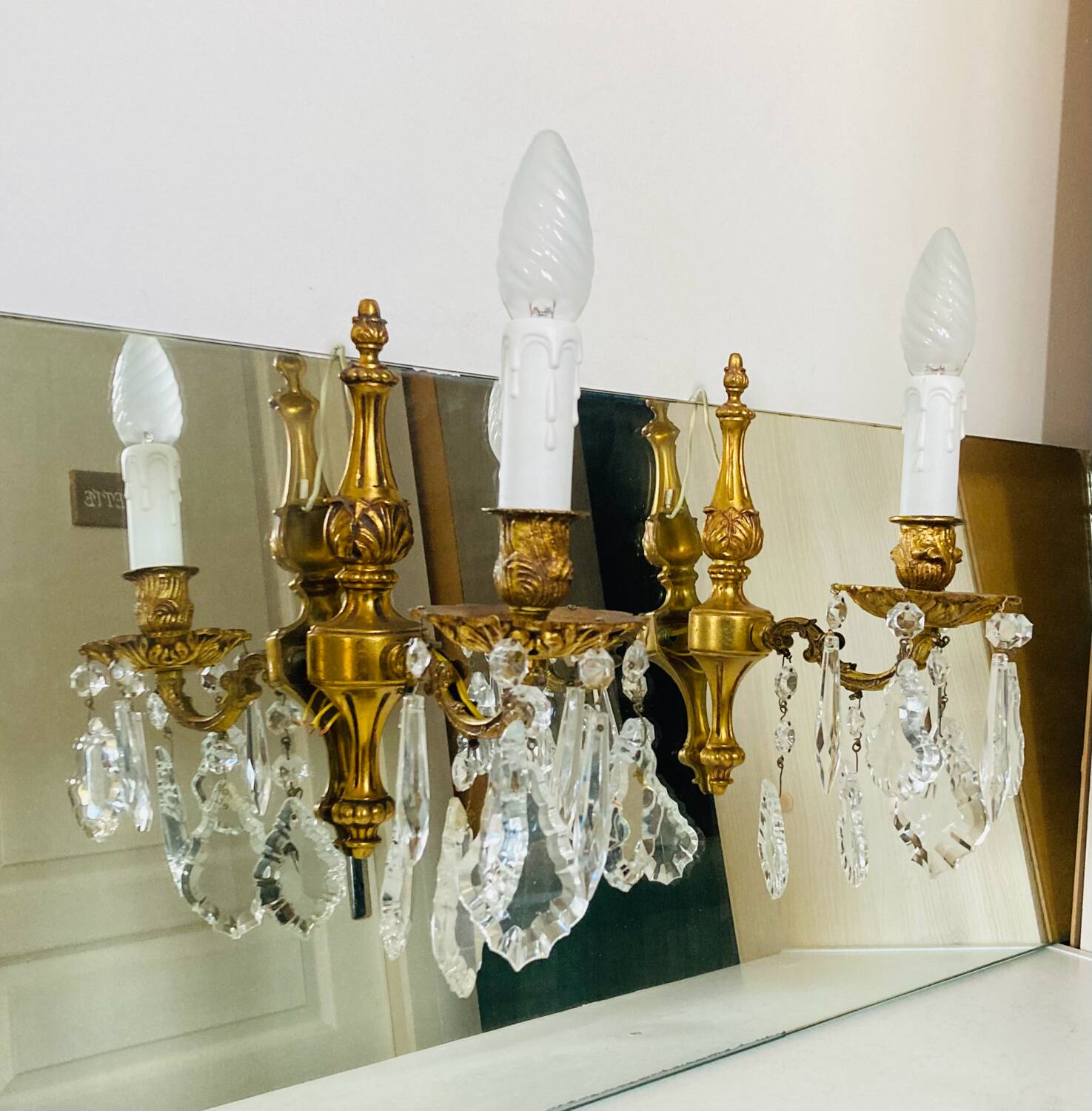 St Louis XV wall lights in gilded bronze with pendants from the mid-20th century.