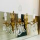 St Louis XV wall lights in gilded bronze with pendants from the mid-20th century.