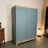 Wardrobe with two wardrobe compartments and drawers