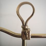 Desk lamp in brass with a swan neck and green opaline glass.