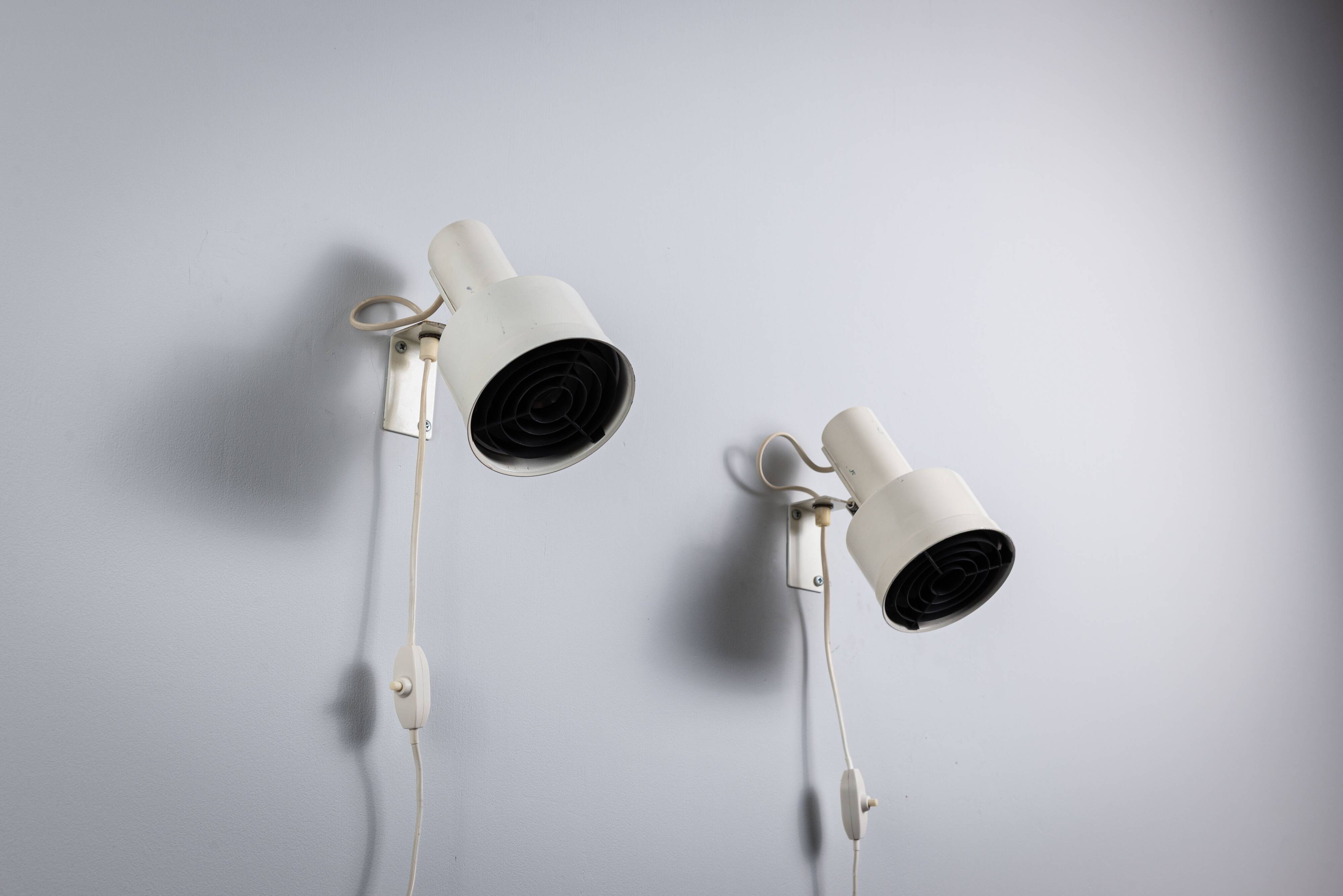 Pair of adjustable wall lamps designed by Per Sundstedt for Kosta Lampan
