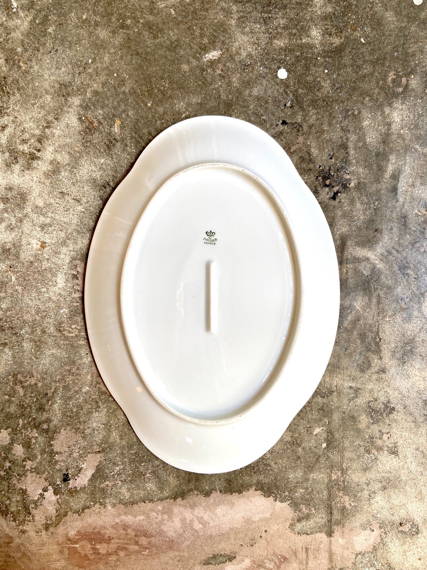 Oval dish in white and golden Limoges porcelain