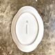 Oval dish in white and golden Limoges porcelain