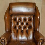 Captain's chair Chesterfield vintage leather with tufted wingback.