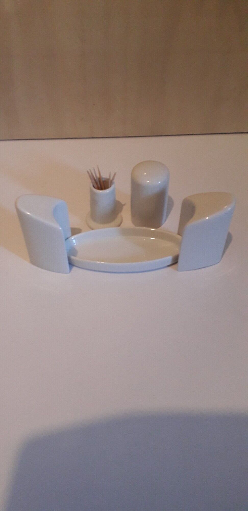 Set salt shaker, pepper tree and covered ceramic pot on small tray