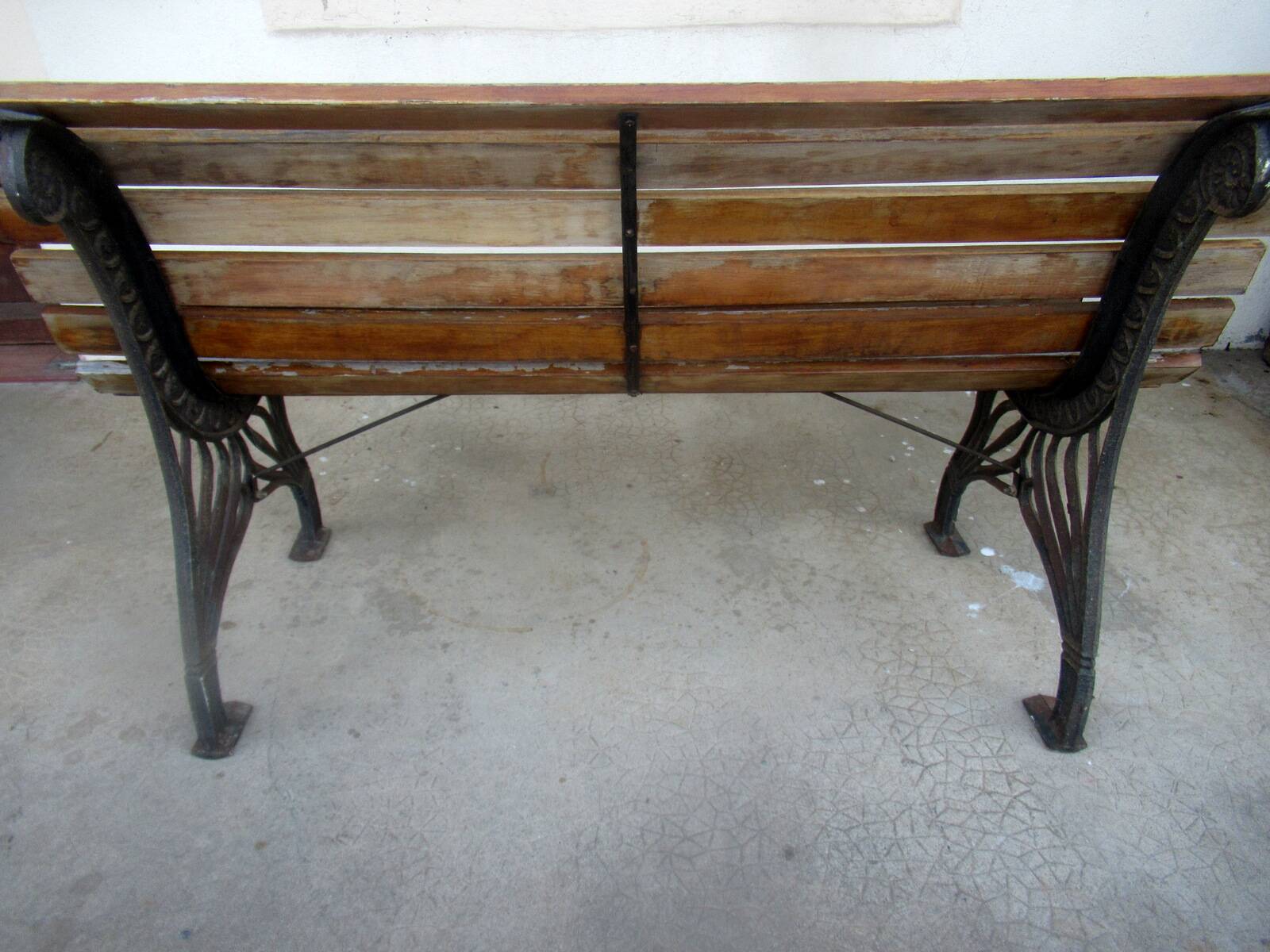 Small garden bench, with cast iron legs.
