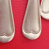 11 Small silver-plated spoons.