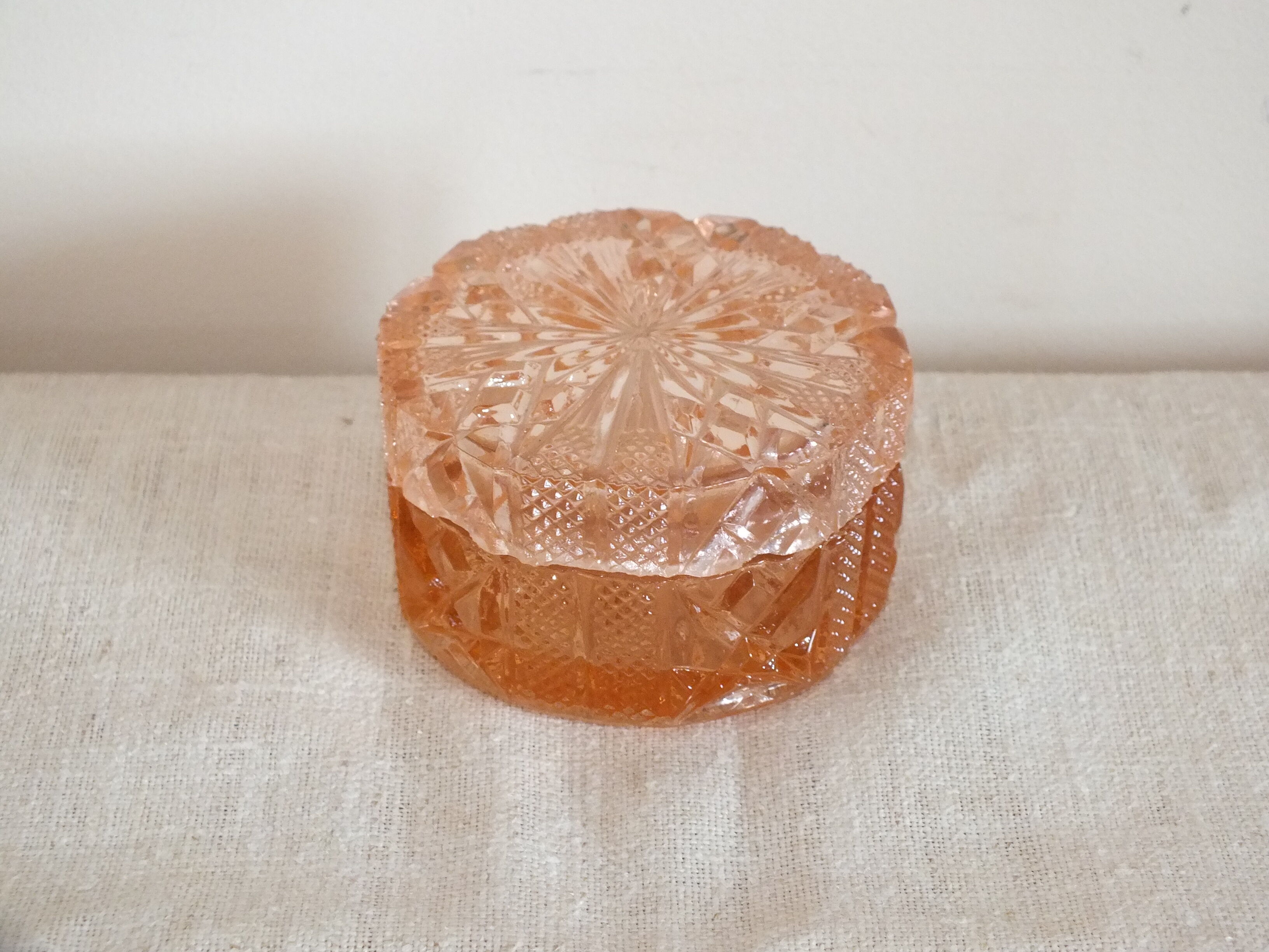 Pink tinted molded crystal powder box