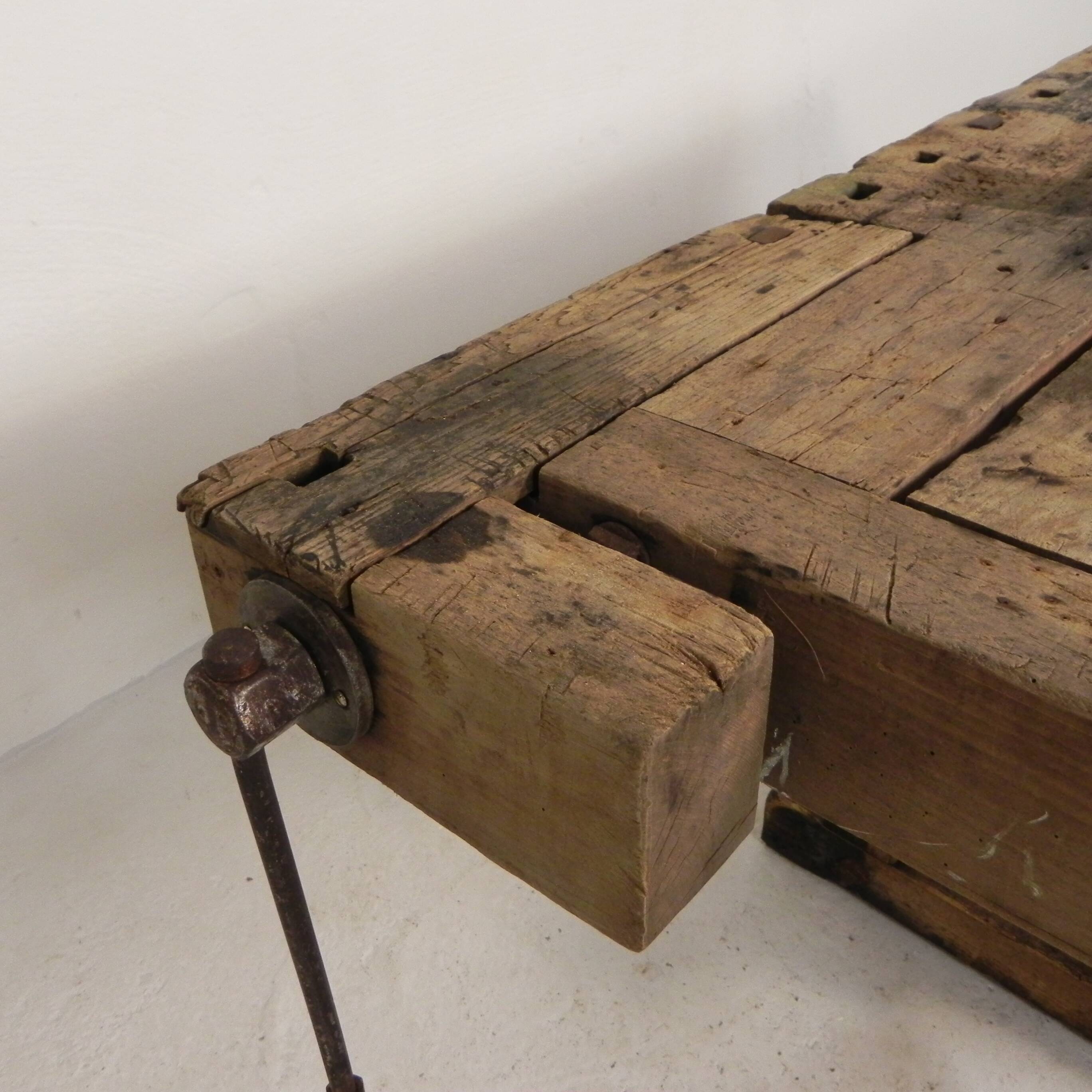 Wooden industrial workbench with vice, 194 cm long, 1930s.