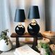 Duo de lampes en opaline noire art déco