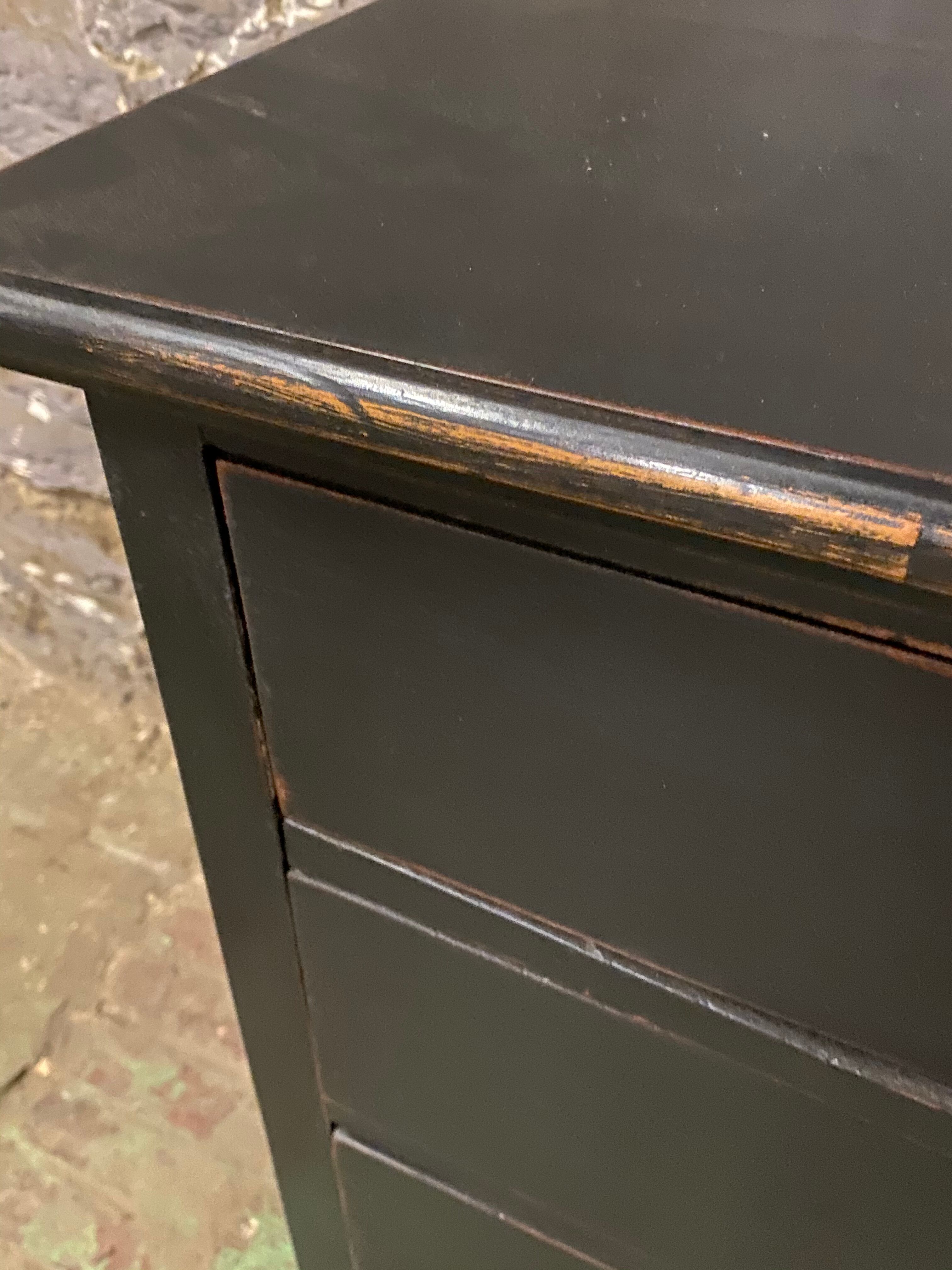 Old black patinated chest of drwers