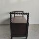 Natural wood chest forming a bench, ringed shoulders