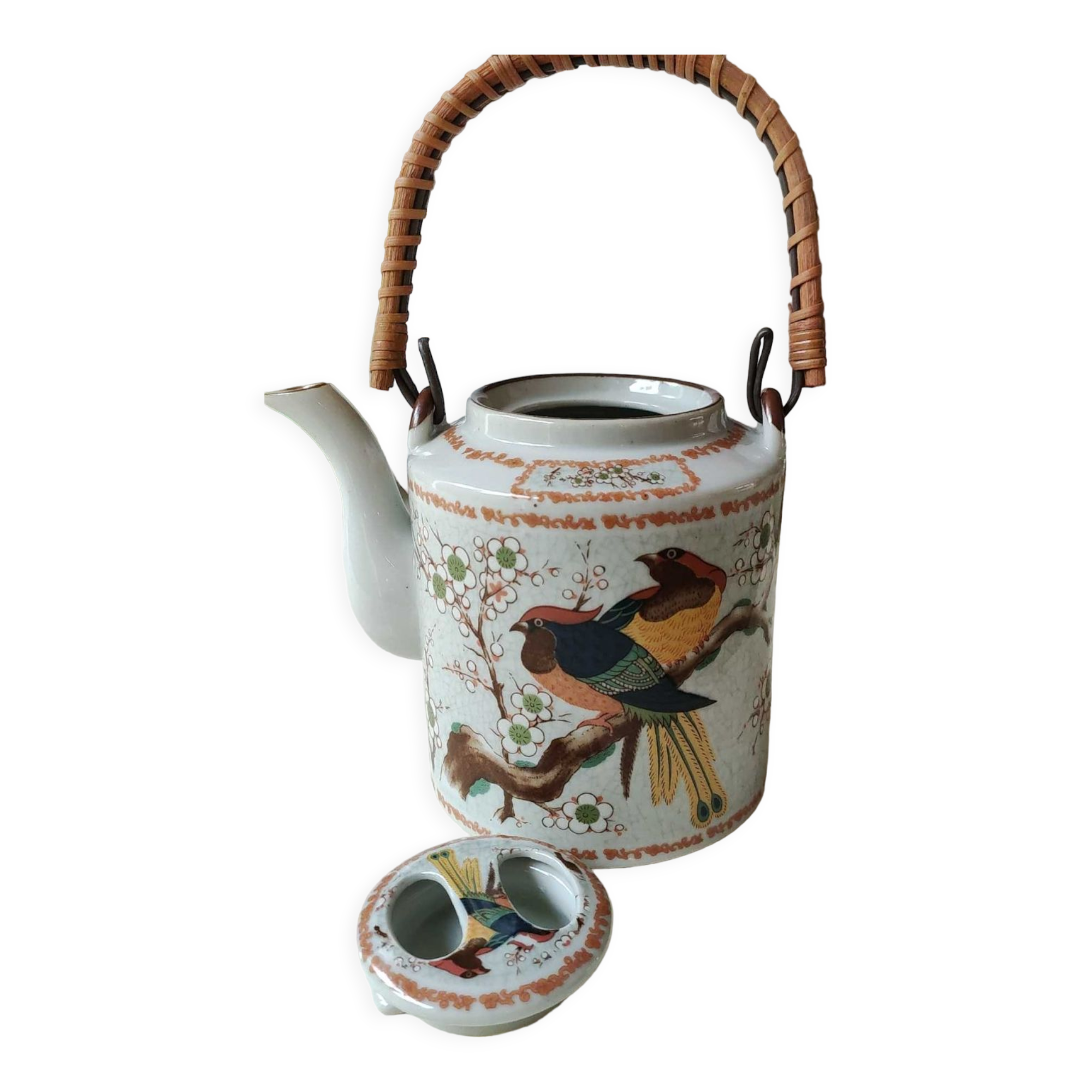 Japanese ceramic teapot. bird/paradise motifs/cherry trees. bamboo/rattan braided handle