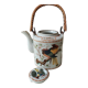 Japanese ceramic teapot. bird/paradise motifs/cherry trees. bamboo/rattan braided handle