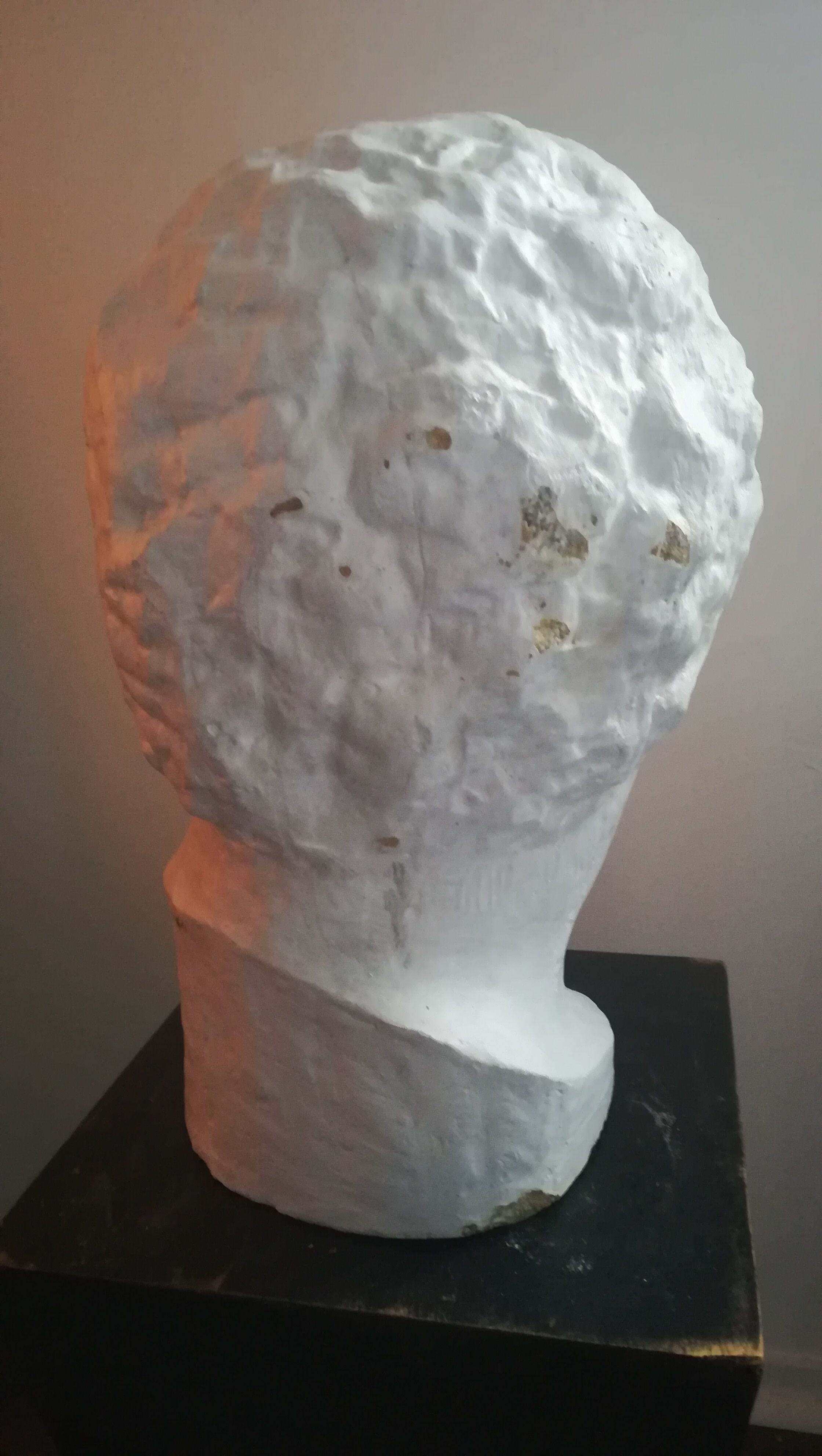Patinated plaster man head.