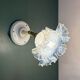 Vintage tulip glass wall light in transparent, slightly pearlescent white.