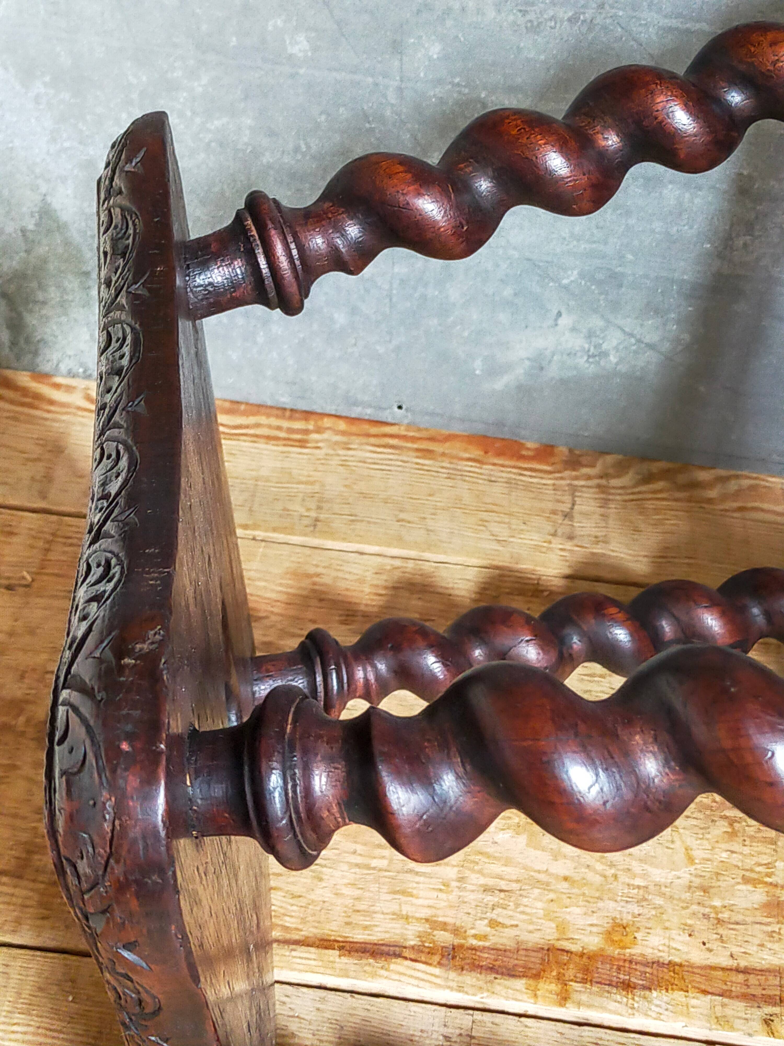 Antique stool in turned and carved solid wood