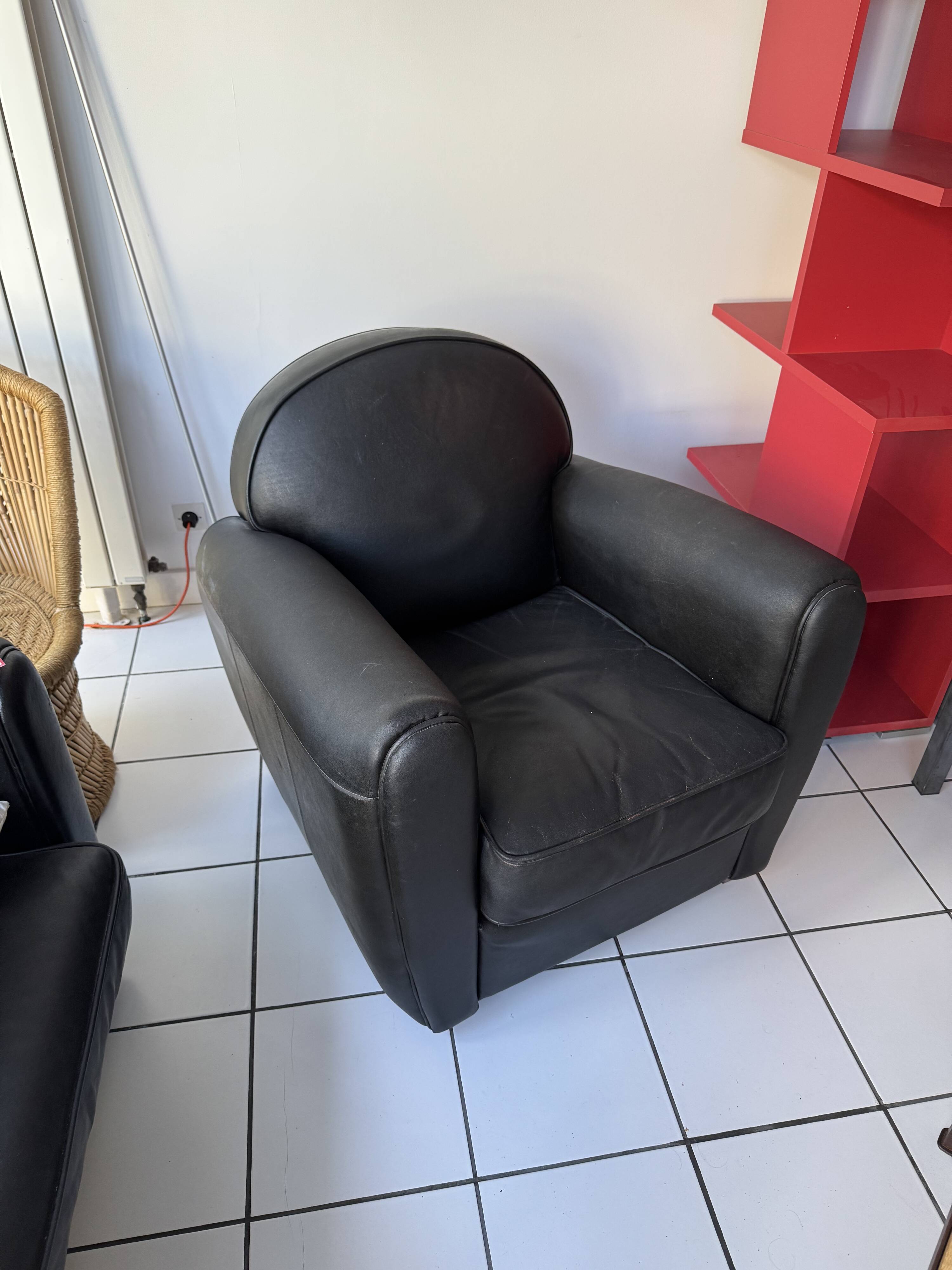 Matching black leather armchair – comfort and elegance
