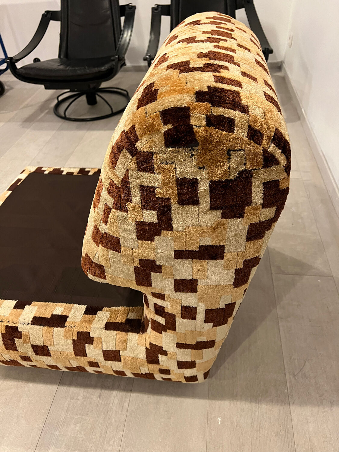 Vintage armchair from the 70s in beige and brown.