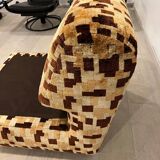 Vintage armchair from the 70s in beige and brown.