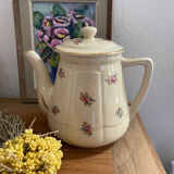 Old teapot or coffee maker in English style.