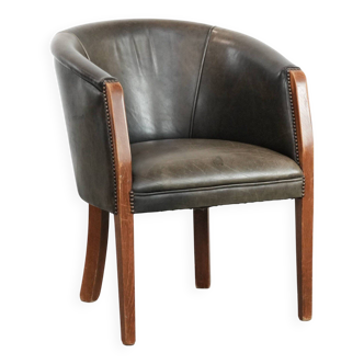 Sturdy cow leather and wooden tub chair with a beautiful colour scheme