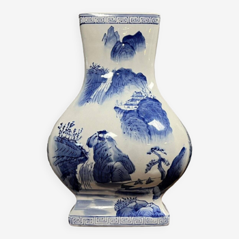 China circa 1920: porcelain vase with blue and white decoration with swollen body