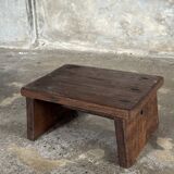 Small auxiliary stool in upcycled teak with traces of green chrome on the leg.
